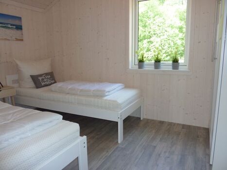 eines von 3 Schlafzimmern, dieses mit getrennten Betten