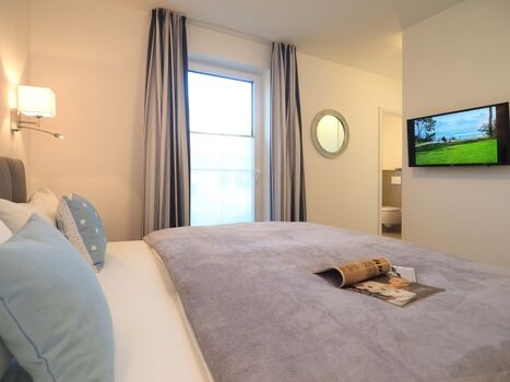 Schlafzimmer mit Badezimmer en Suite