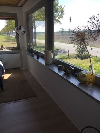 Wintergarten mit gemütlichem Sofa,und Blick Richtung Westen (Sonnenuntergang).