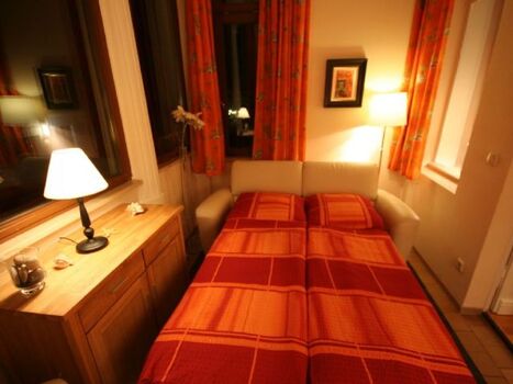 Veranda mit ausgezogenem Sofa