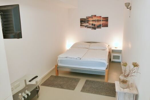 Zweites Schlafzimmer mit Sitzbereich