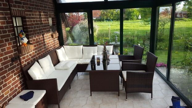 Wintergarten mit Loungesitzgruppe