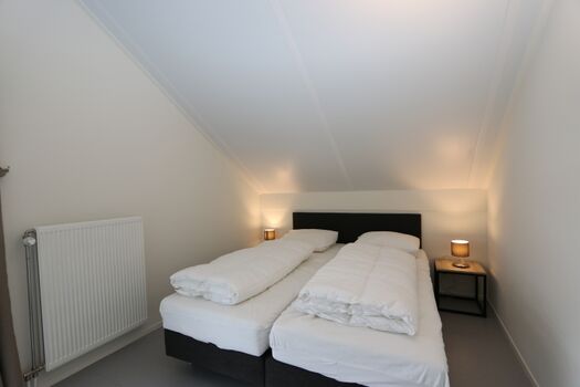 Schlafzimmer mit Doppelbett