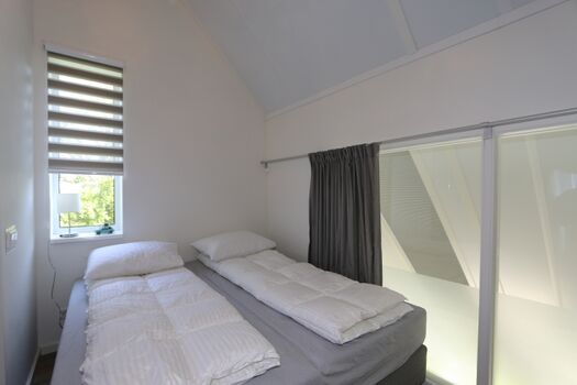 Schlafzimmer mit Doppelbett