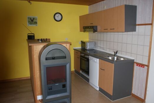 Küche mit Elektrokamin