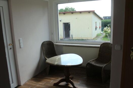 Vorraum mit kleiner Sitzgruppe