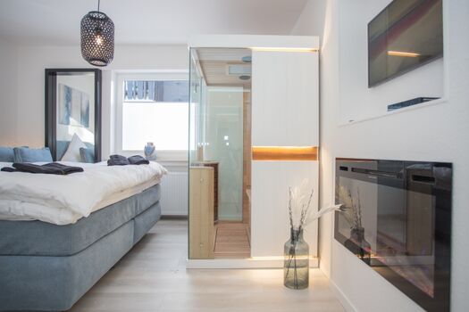 Schlafzimmer mit Infrarotsauna u. Elektrokamin
