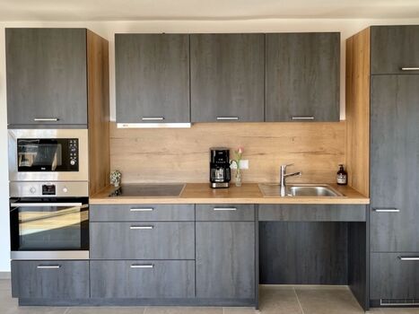 Die vollausgestattete und moderne Küche 