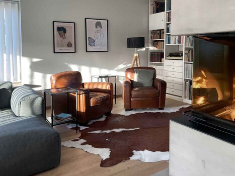 TIDE4 Ferienwohnung Amrum Apartment 8 Wohnbereich mit Kaminofen
