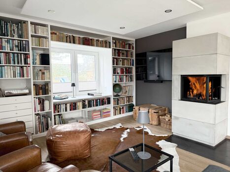 TIDE4 Ferienwohnung Amrum Apartment 8 Wohnbereich mit Kaminofen