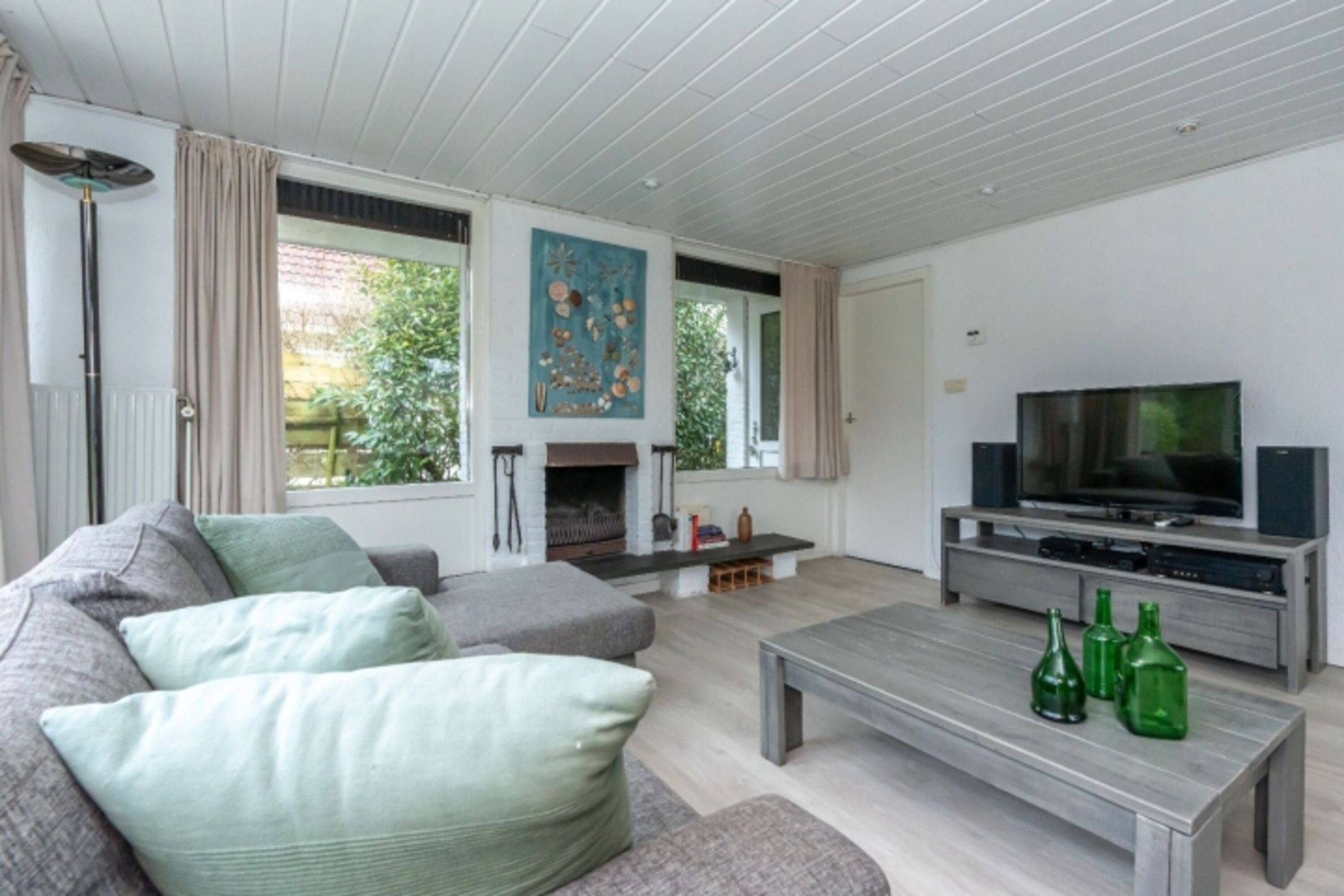 Die gemütliche Sitzecke mit Kamin und SMART TV