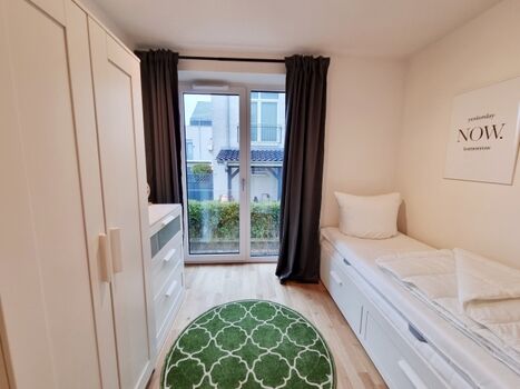 das Schlafzimmer mit Ausziehbett