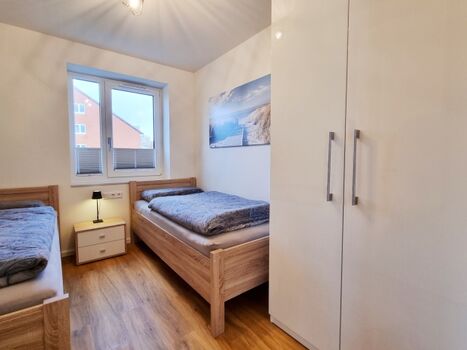 das Zweibettzimmer mit TV