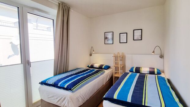 das Zweibettzimmer mit Meerblick