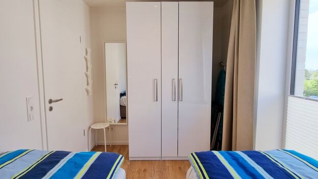 das Zweibettzimmer mit Meerblick
