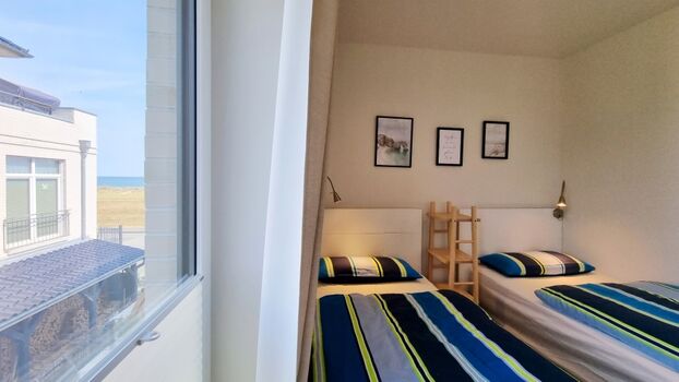 das Zweibettzimmer mit Meerblick