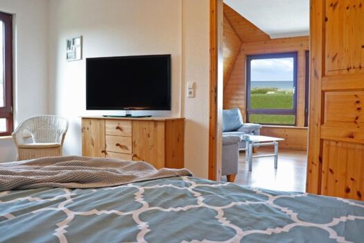 Meerblick aus dem Bett und Smart-TV