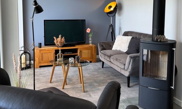 Wohnzimmer mit Kamin