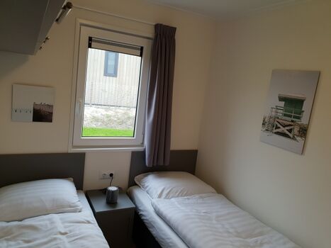 Schlafzimmer 3 ausgestattet mit zwei Boxspring Einzelbetten