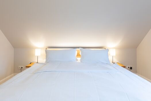 Biikehuus West - Schlafzimmer mit großem  Doppelbett