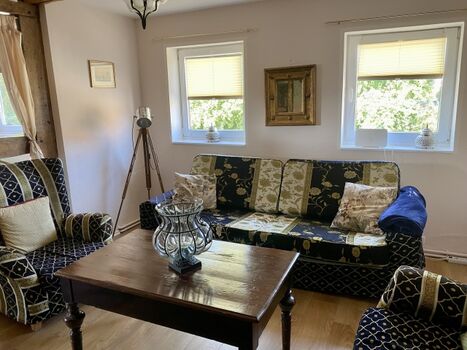 Wohnzimmer mit Schlafcouch 1 te Etage