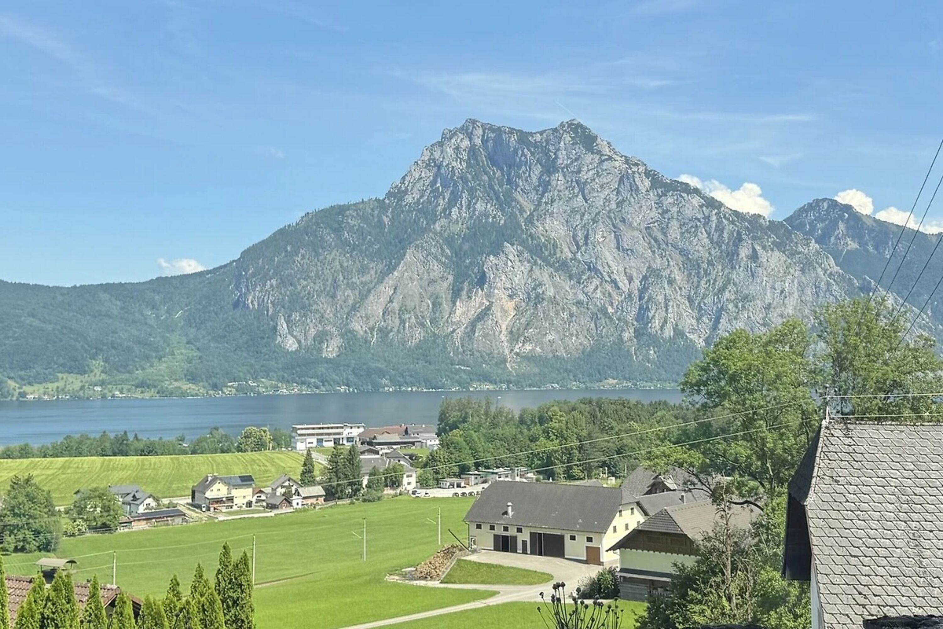 Ferienwohnung Bergliebe - Panorama Seeblick und Bergblick von Ferienwohnung und eigenem Garten aus.