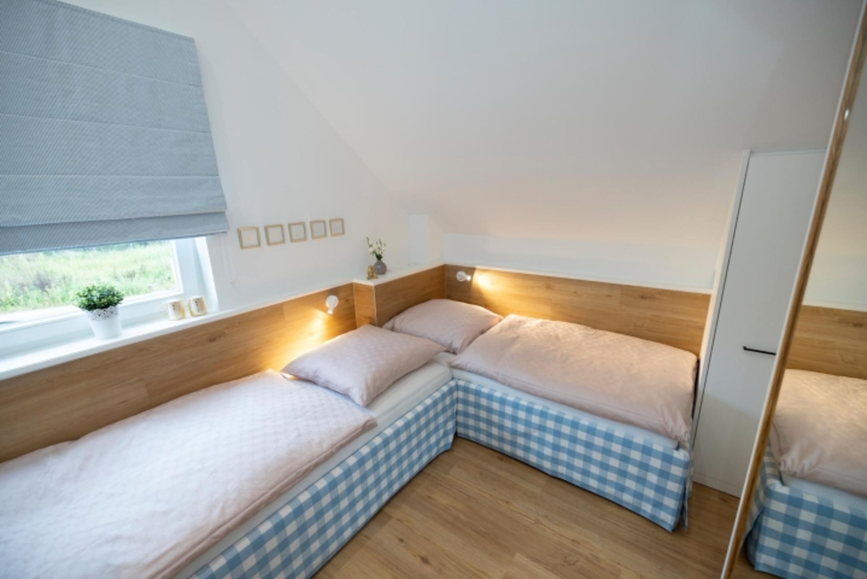 Villa am See - Das Schlafzimmer mit zwei Einzelbetten