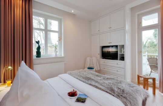 Schlafzimmer mit Balkonzugang