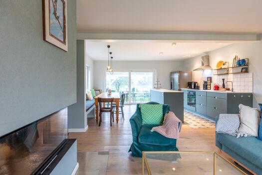 Ferienhaus Deichglück - Gemütlicher Wohnbereich mit Kamin