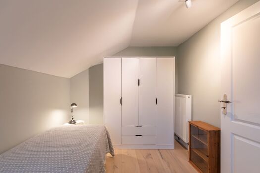 Ferienhaus Deichglück - Schlafzimmer mit Einzelbett