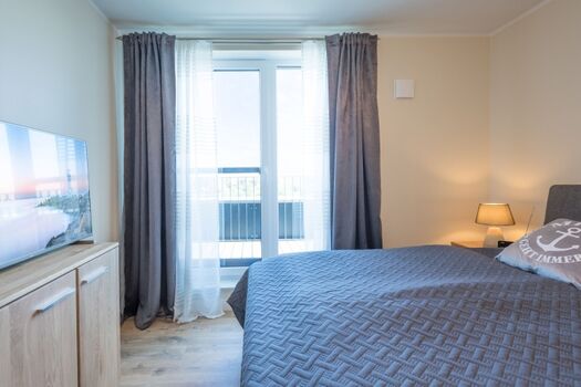 Penthouse SeeZeichen - Schlafzimmer mit eigenem Zugang zur Terrasse 