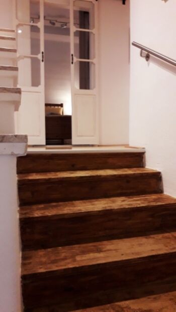 Die Holzstiege in den ersten Stock