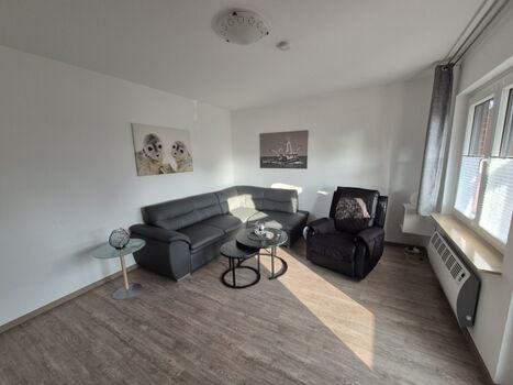 Couchgarnitur im Wohnraum Ferienhaus Helmsand 3 Friedrichskoog Nordsee
