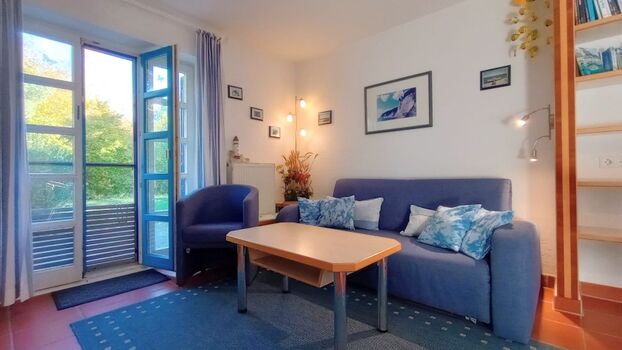 Die gemütliche Sitzgruppe mit Schlafsofa