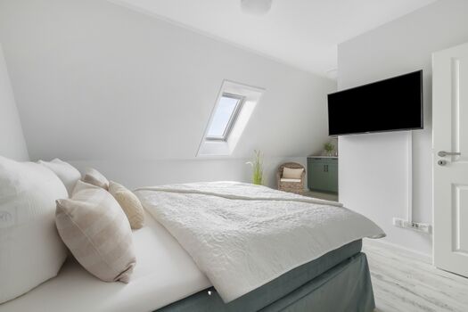 Blick in ein Schlafzimmer im OG