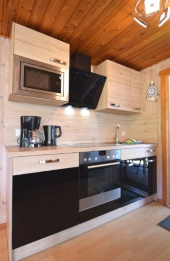 die vollausgestattete Küche 