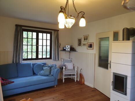 Wohnzimmer Schlafsofa Kachelofen