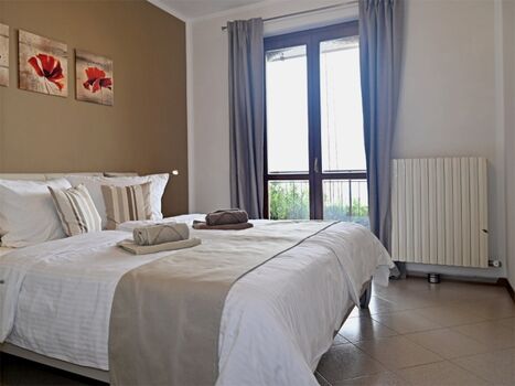 Schlafzimmer mit Blick auf den See