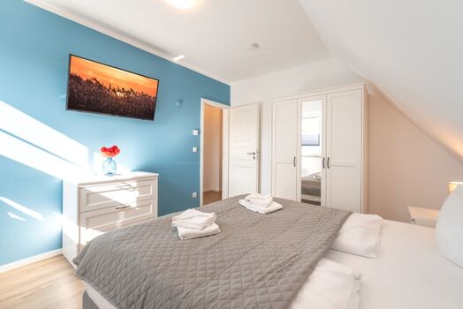 Schlafzimmer 1 mit Doppelbett im Obergeschoss