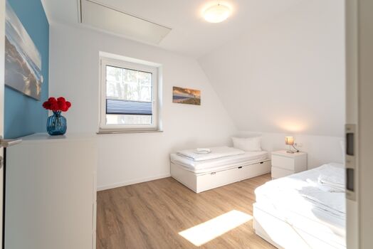 Schlafzimmer 2 mit zwei Einzelbetten im Obergeschoss