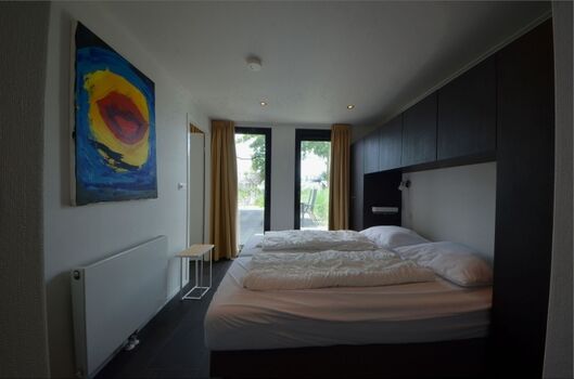 Schlafzimmer 1 mit Bad en Suite