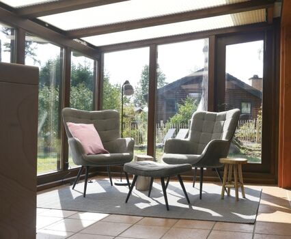 Wintergarten mit Holzofen