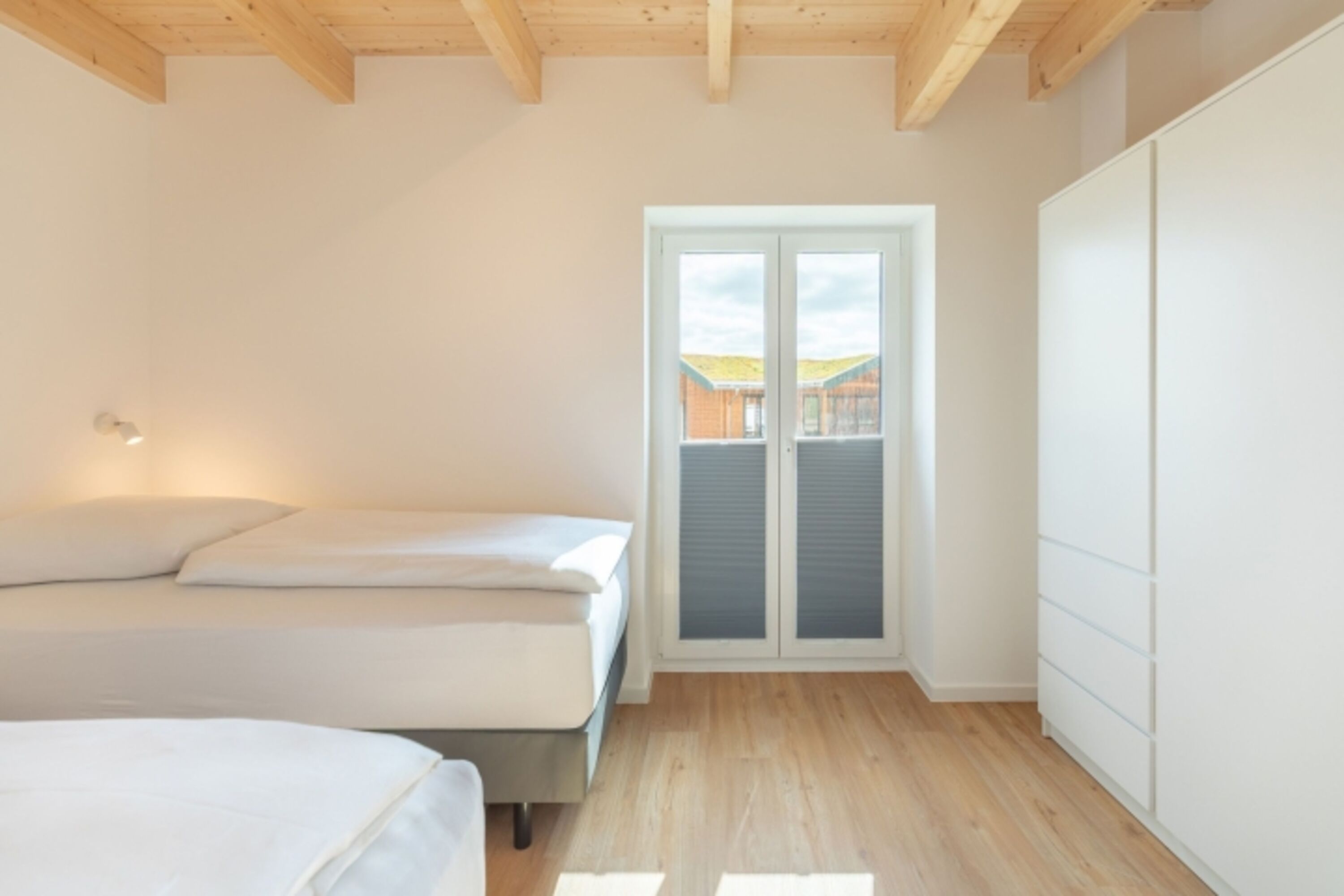 Huus Eekboom - Schlafzimmer 1 mit gemütlichen Einzelbetten