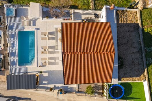 sparkling 41m² heated pool with ten sun loungers