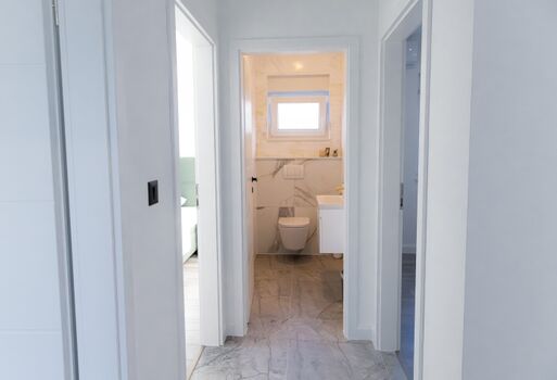 The house also includes a separate guest toilet for added convenience.