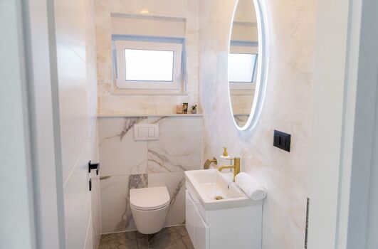 The house also includes a separate guest toilet for added convenience.