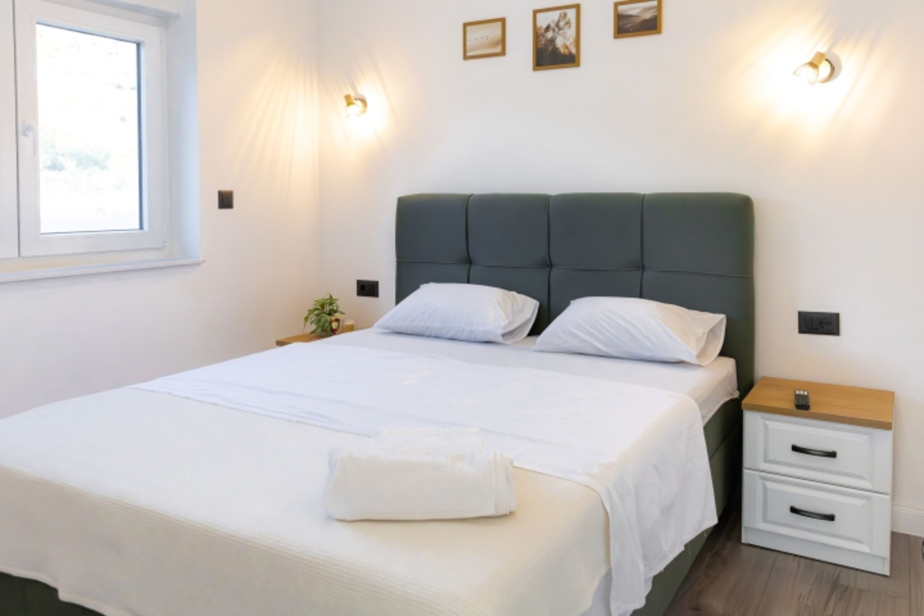 The third bedroom features a queen-size bed and is equipped just like the other two – with air conditioning and a flat-screen TV.