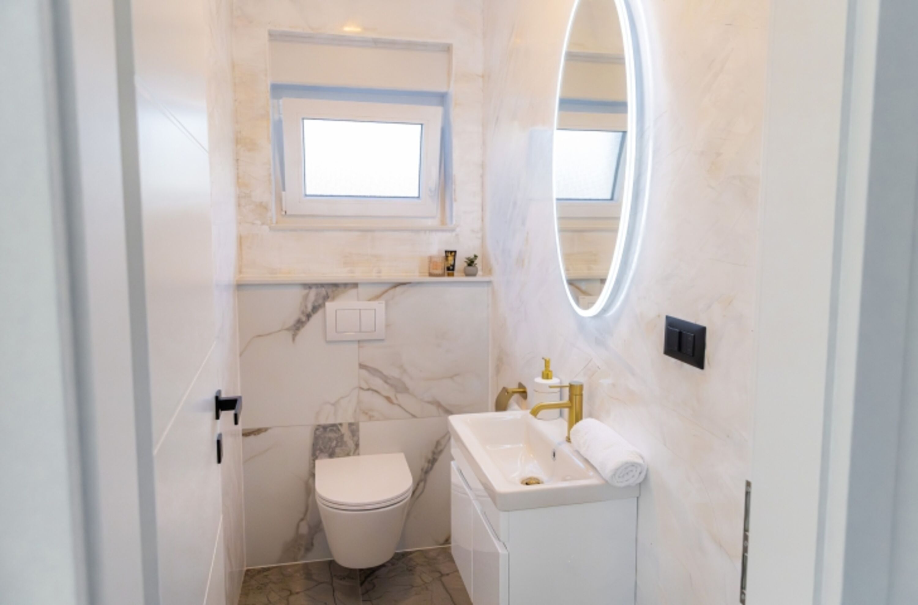 The house also includes a separate guest toilet for added convenience.