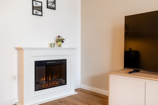 Wohnzimmer mit Kamin