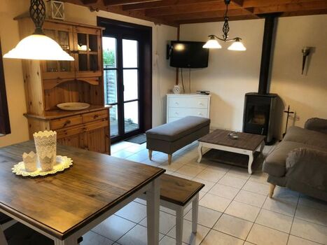 Wohnzimmer mit Ofen Polderhaus